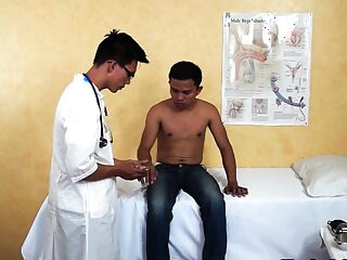 A slim Asian guy gets a bareback enema from his doctor, who then cums inside him.